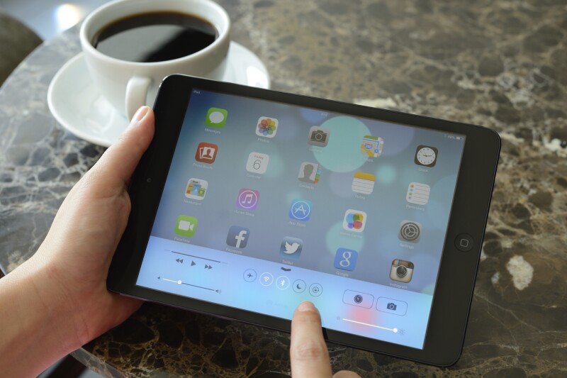 person using ipad-aarp