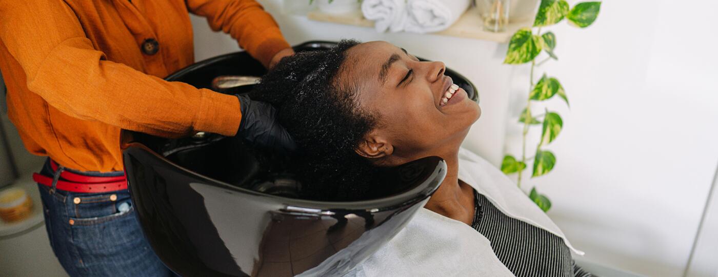 image_of_woman_getting_hair_washed_at_salon_GettyImages-1306817649_1800