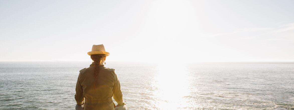 Woman Meditating In Nature By Ocean
