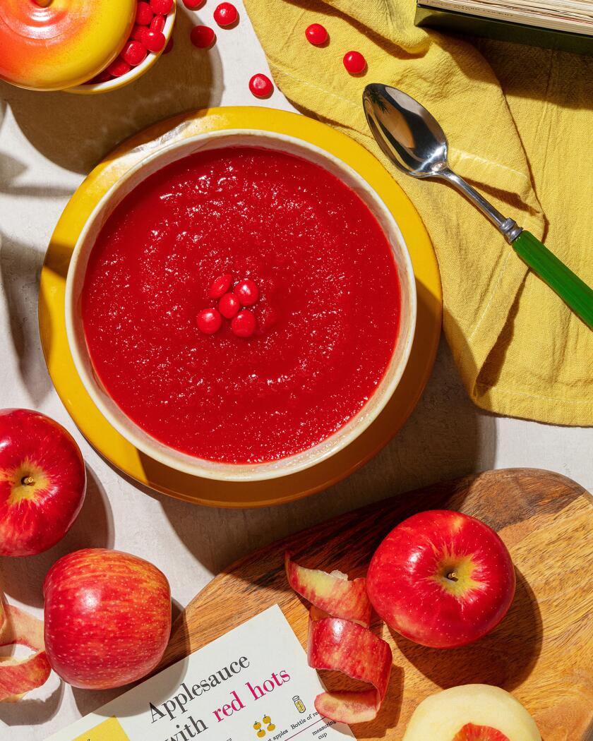 Overhead shot of red hot applesauce in a bowl