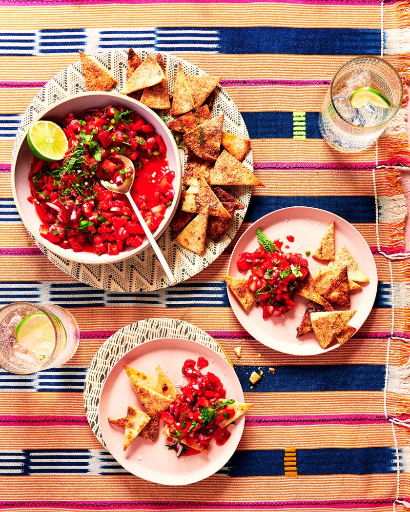 Red foods styled on a bright colored tablecloth
