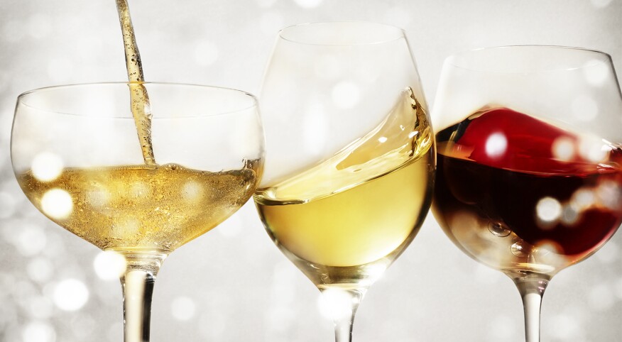 An image of three different holiday wines in wine glasses.