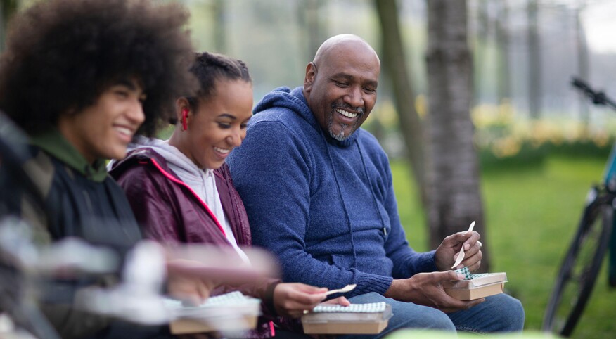 Father with teen children in the park