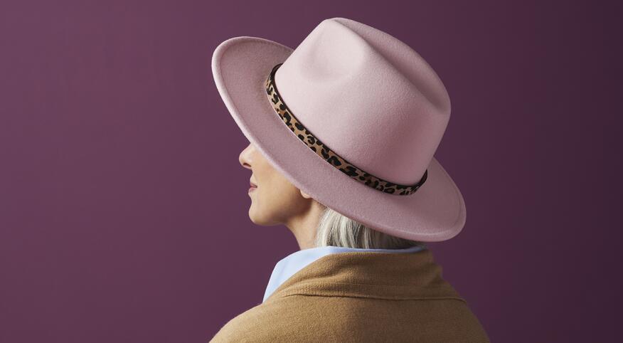 Woman in pink hat with animal print detail