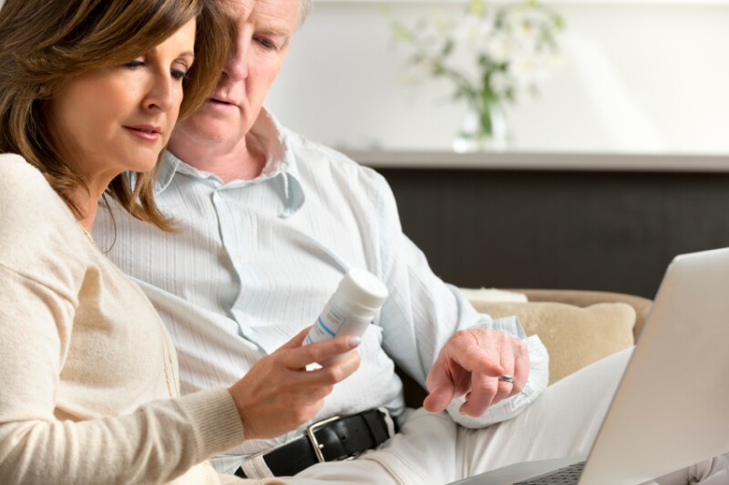 Mature couple researching medicine on the internet