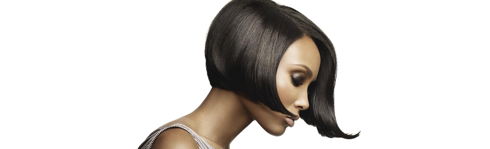 beautiful black woman seen from the side wearing a short-bobbed wig