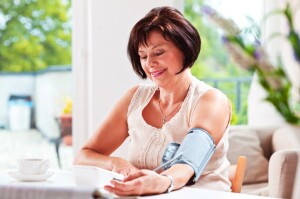 Woman monitoring her blood pressure