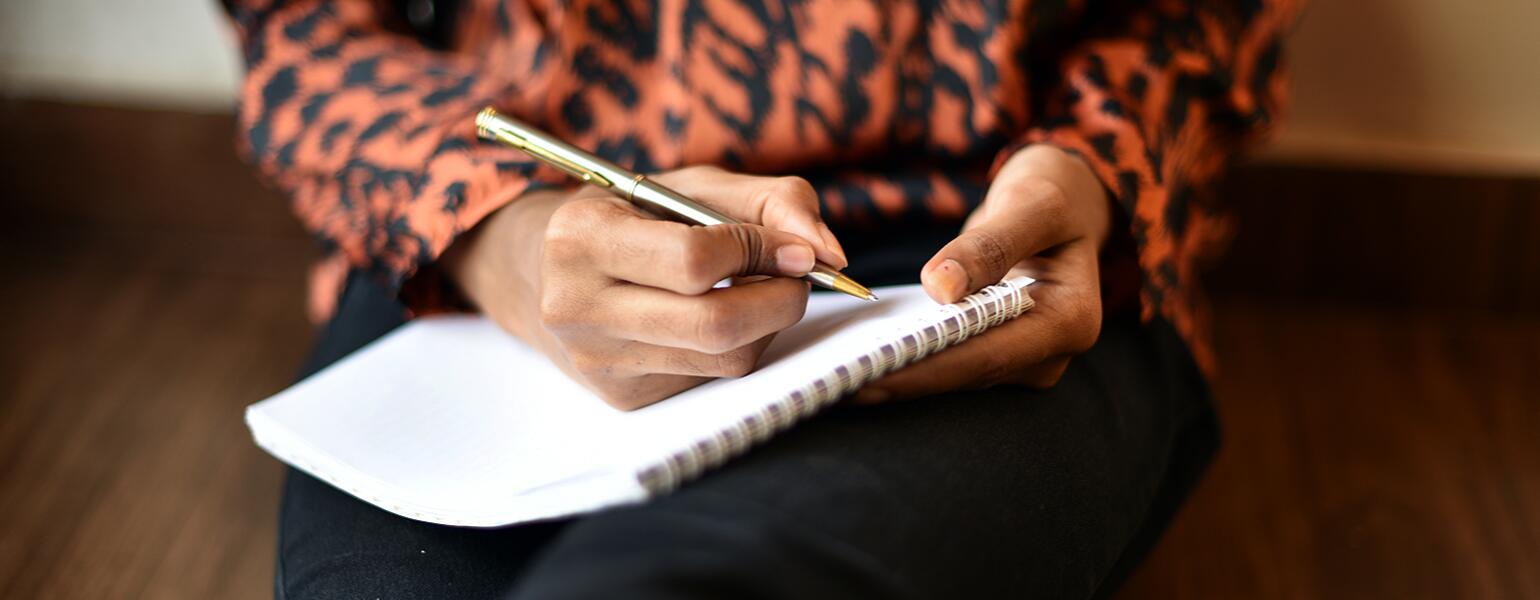 image_of_womans_hands_writing_in_notebook_GettyImages-1020523958_1540.jpg