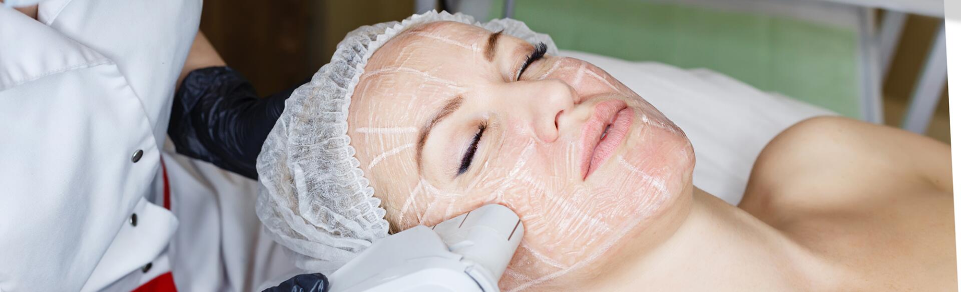 A photo of a woman undergoing an ultherapy treatment.