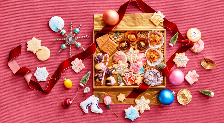 Holiday cookies and sweet treats, inside gift box with ribbon and ornaments