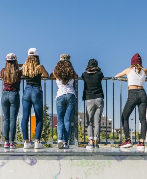 Back View Of A Group Of Stylish Teen Girls
