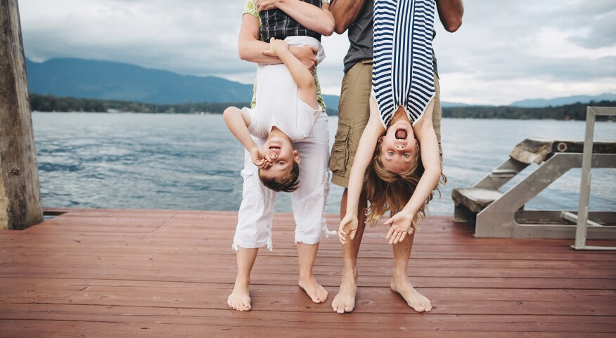 parents hanging out with their kids at a dock