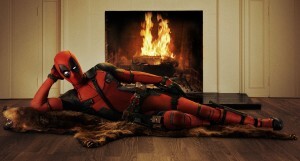 Deadpool laying next to fireplace