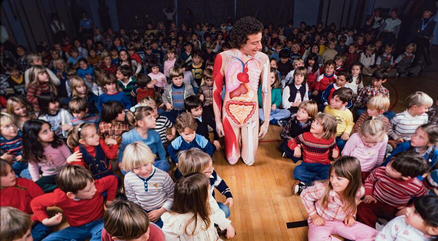 American actor and educator John Burstein, in costume as his fictional character, 'Slim Goodbody'