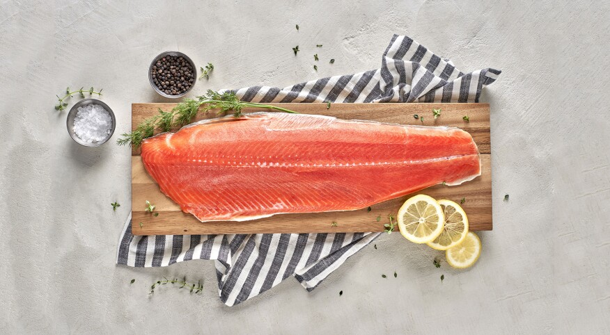 salmon filet on wooden slab shown for brain food