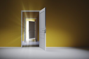 Open white doors with rays of light on blue wall