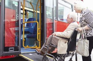 Senior couple boarding bus
