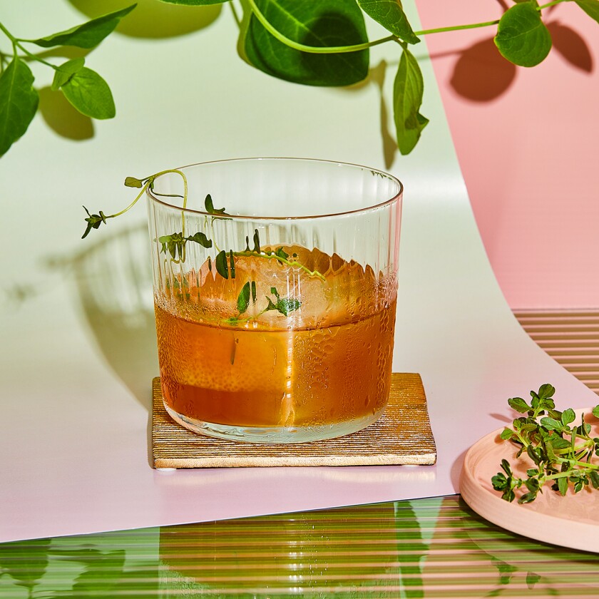 Bourbon Thyme Cocktail with greenery