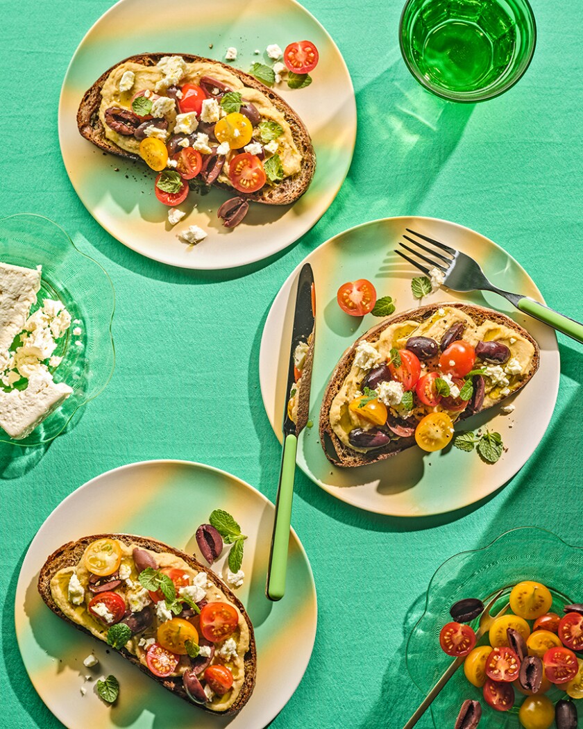 Three slices of Greek Toast from above on a green background