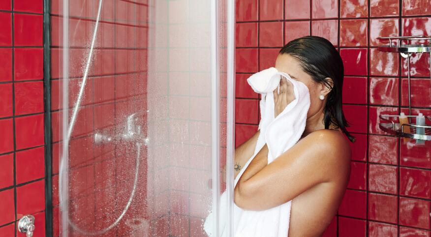 woman drying off in shower and why you are probably taking showers the wrong way