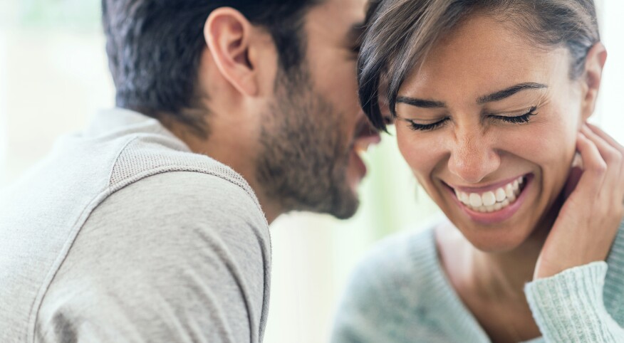 An image depicting a man over 40 speaking with a woman.