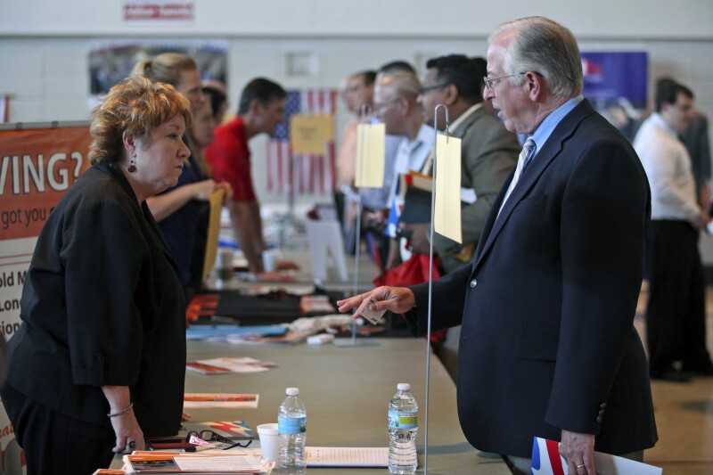Jobless Claims in U.S. Fall While Companies Add Workers
