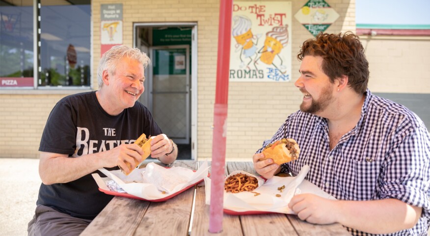 Author and son eating a beef sandwich