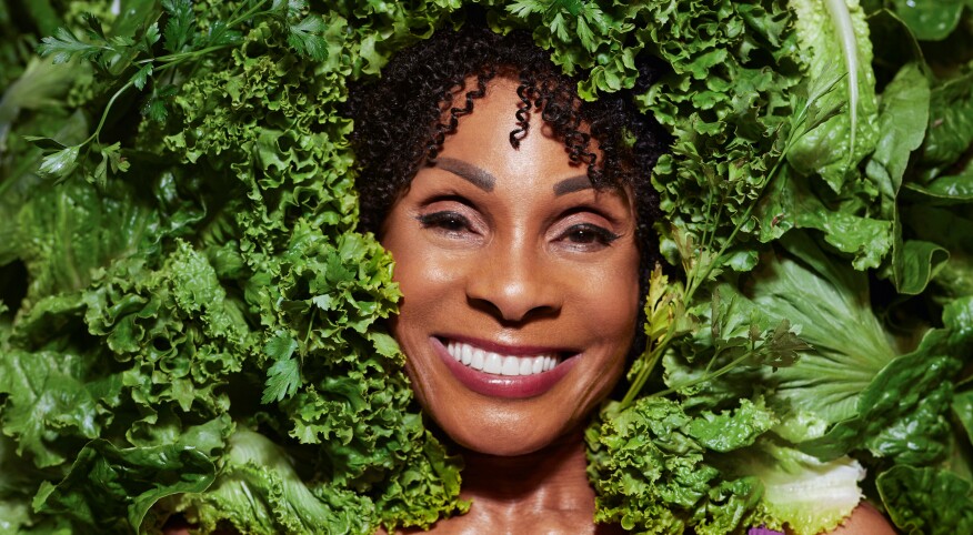 Chef Babette poses with leafy greens