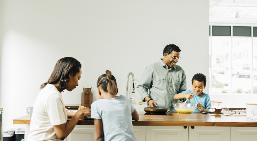 Family cooking in kitchen