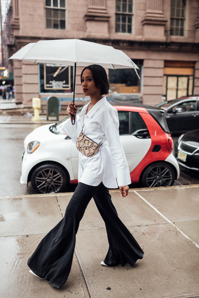 Woman Walking With Umbrella