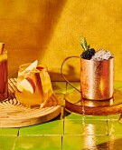 Four beautiful fall mocktails in a glowing warm light