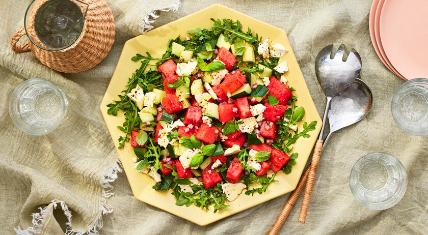 Platter of watermelon salad on a light surface