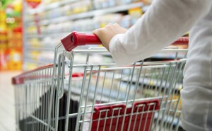 Mystery shopper pushing grocery cart