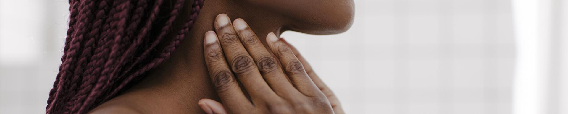 A Woman Touching her Neck