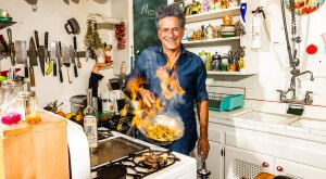 Bob Blumer in kitchen with frying pan on fire