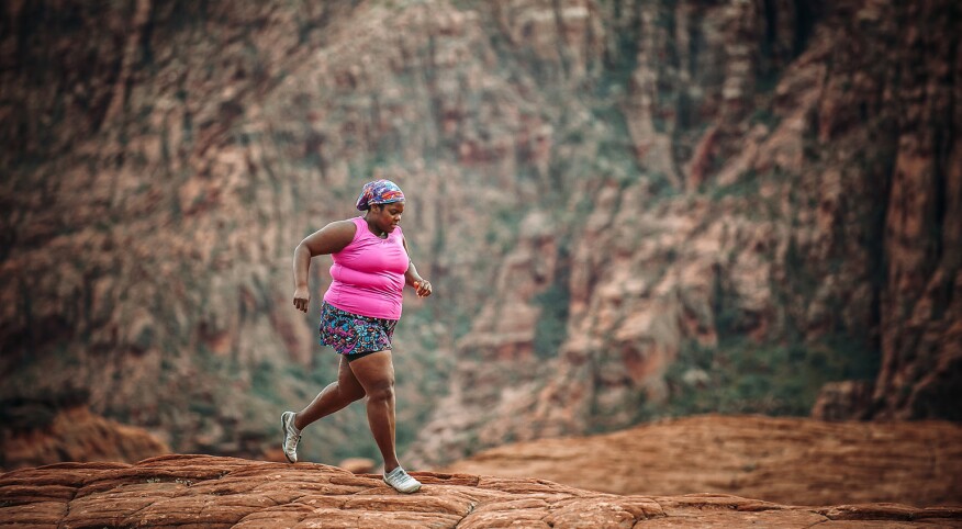 Plus size middle age woman running a marathon