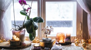 image_of_plant_candles_crystals_on_window_sill_GettyImages-1153716253_1800