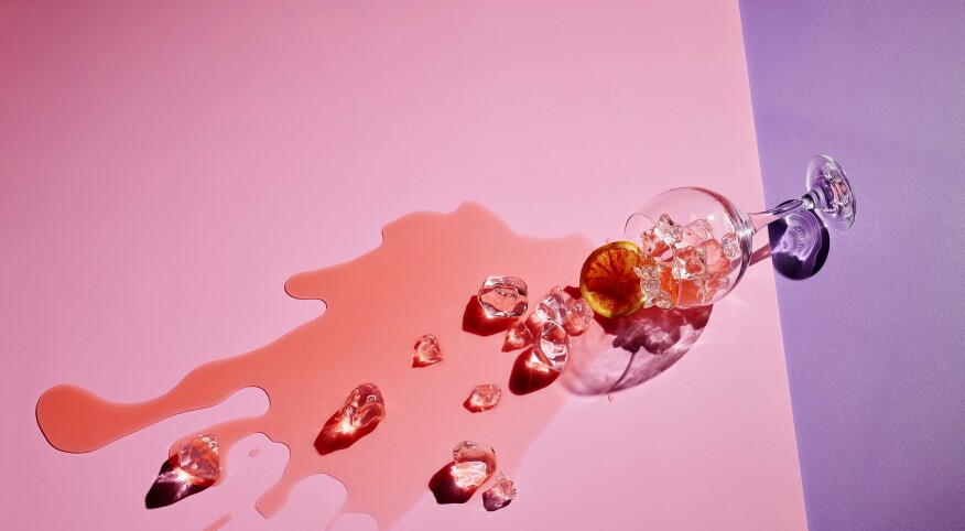spilled cocktail on pink and purple background