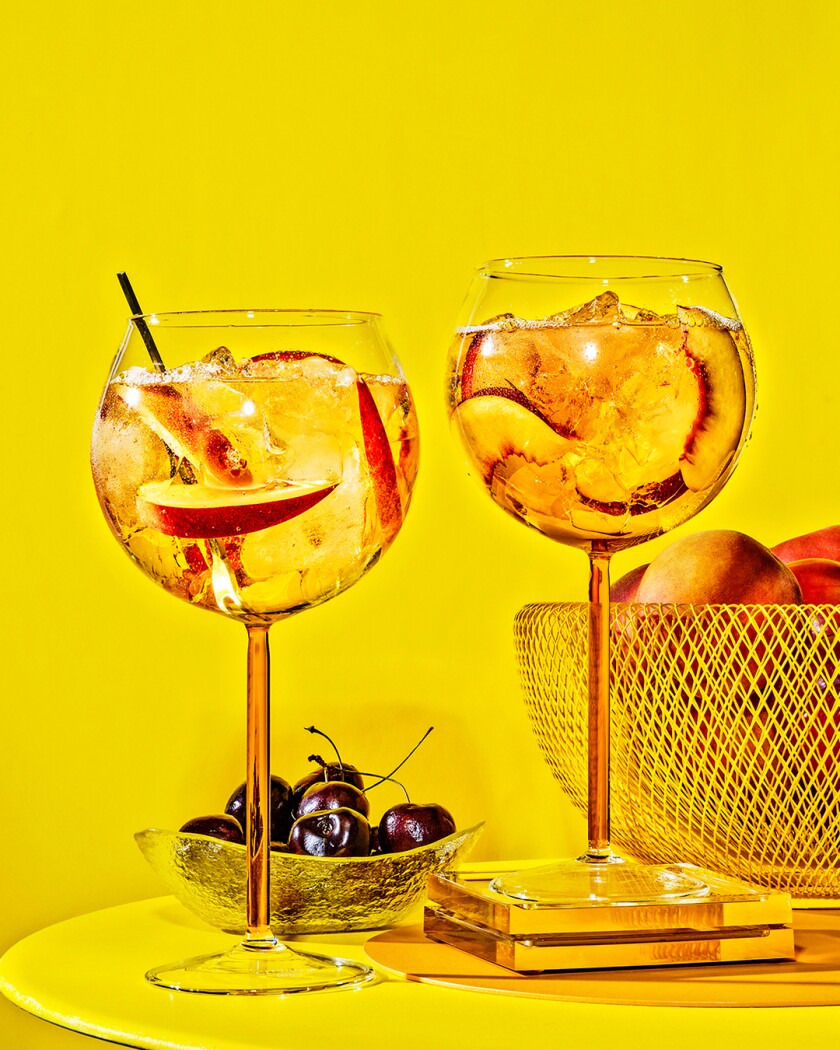 Sangria cocktails on bright yellow background
