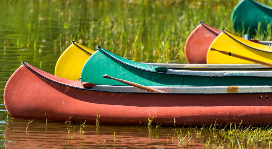 I still go back to summer camp as an adult, photo of canoes 