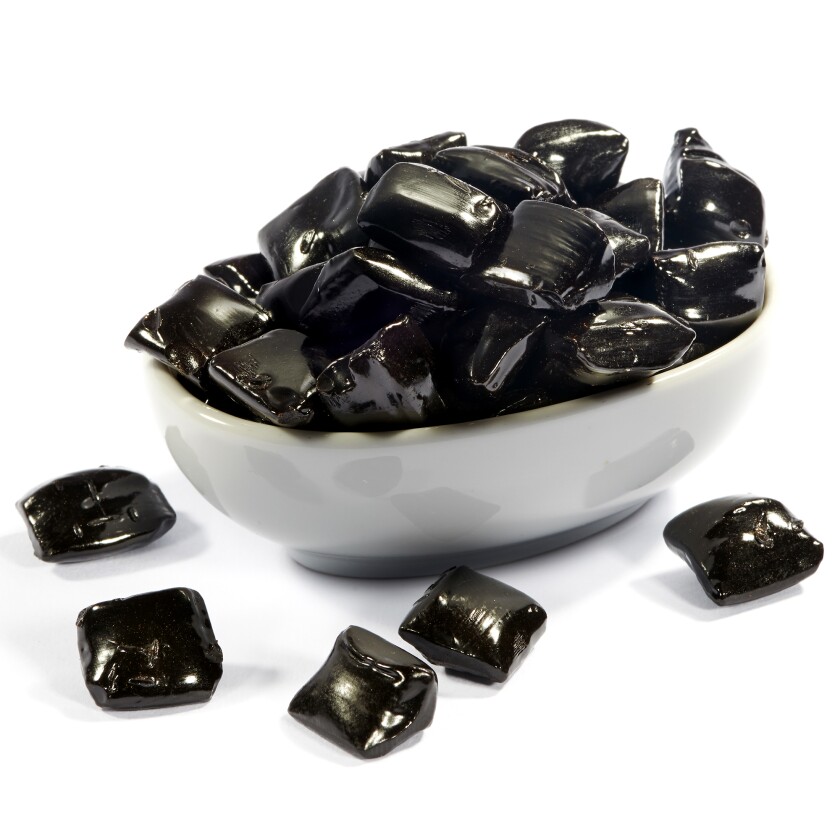 Black licorice in a white bowl