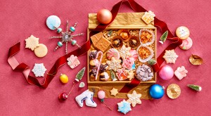 Holiday cookies and sweet treats, inside gift box with ribbon and ornaments