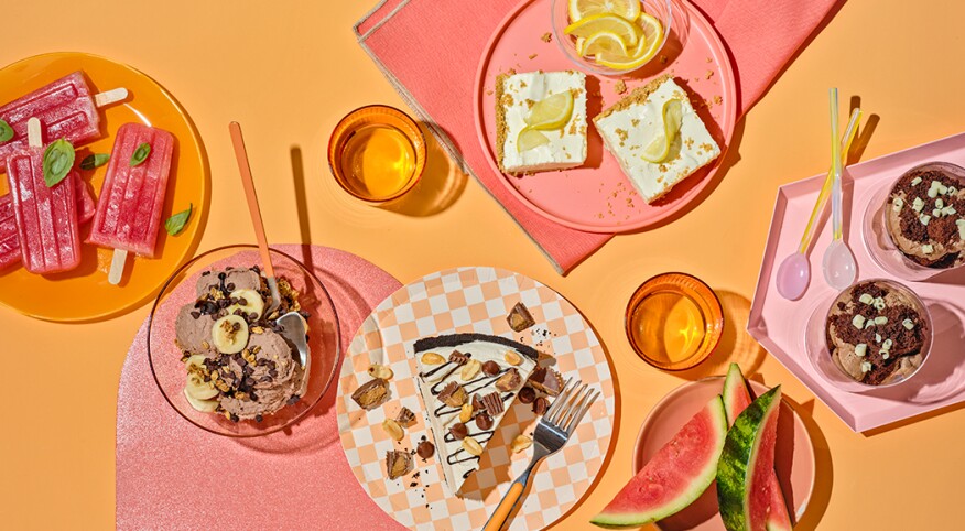 Overhead photo of five frozen desserts on bright orange background