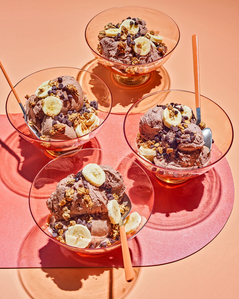 Overhead photo of banana ice cream on bright orange background