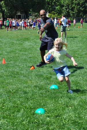Nolan Harrison coaches the kids during NFLPA Former Players Fitness Challenge