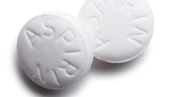 Two white aspirin tablets