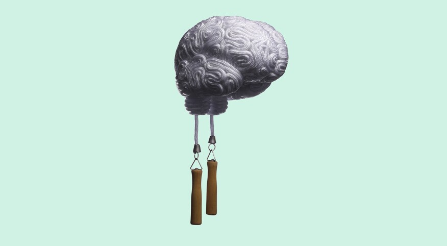A jump rope in the shape of a brain on green background