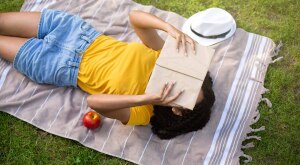 image_of_woman_laying_down_reading_outside_shutterstock_1780559207_1800