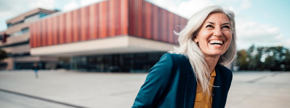 Woman with gray hair working outside