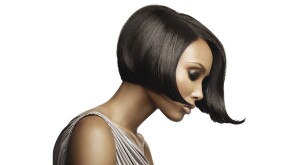 beautiful black woman seen from the side wearing a short-bobbed wig
